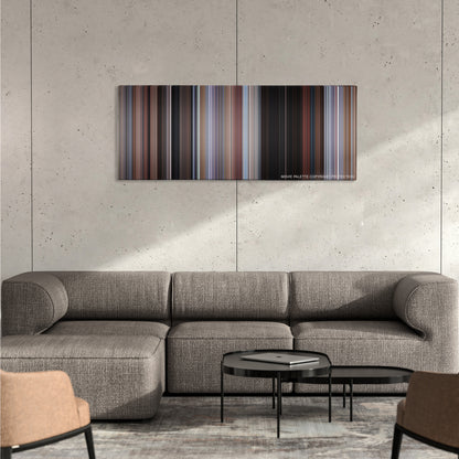 Planes, Trains & Automobiles color palette canvas on a concrete wall above a gray sectional sofa