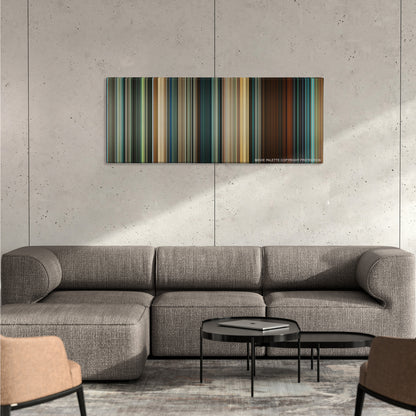 Seven Pounds color palette canvas on a concrete wall above a gray sectional sofa