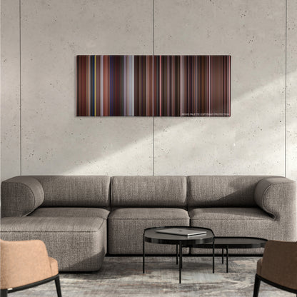 Trainspotting color palette canvas on a concrete wall above a gray sectional sofa