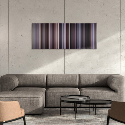 The Departed color palette canvas on a concrete wall above a gray sectional sofa