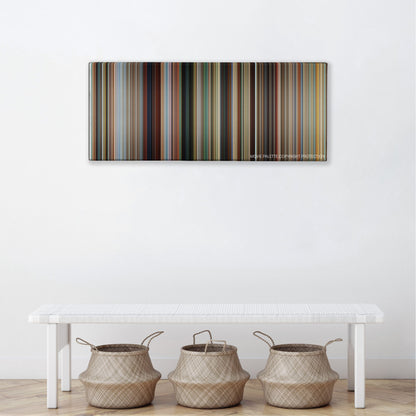 Savages color palette canvas above a white bench with three woven baskets
