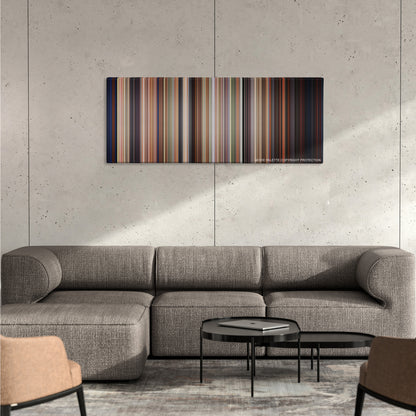 Edward Scissorhands color palette canvas on a concrete wall above a gray sectional sofa