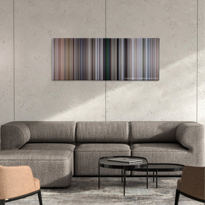 Cliffhanger color palette canvas on a concrete wall above a gray sectional sofa