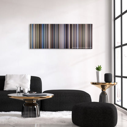 Outbreak color palette canvas above a black sofa with a gold-topped table