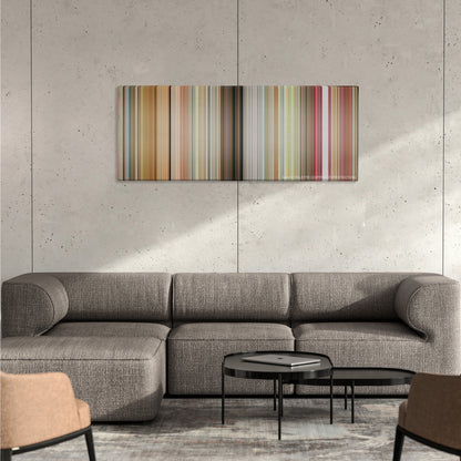Little Miss Sunshine color palette canvas on a concrete wall above a gray sectional sofa