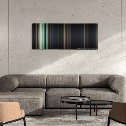 The Nun color palette canvas on a concrete wall above a gray sectional sofa