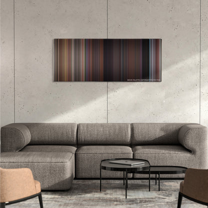 Before Sunrise color palette canvas on a concrete wall above a gray sectional sofa