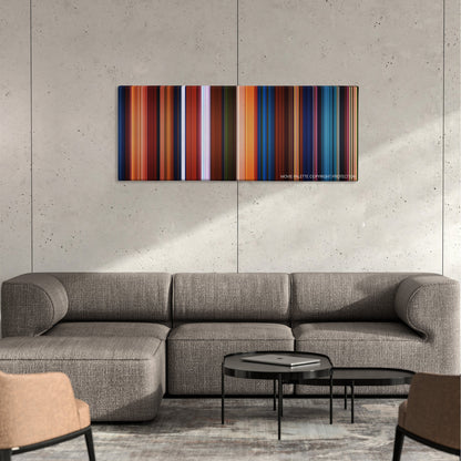 Kubo and the Two Strings color palette canvas on a concrete wall above a gray sectional sofa