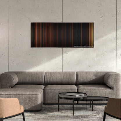 The Strangers color palette canvas on a concrete wall above a gray sectional sofa