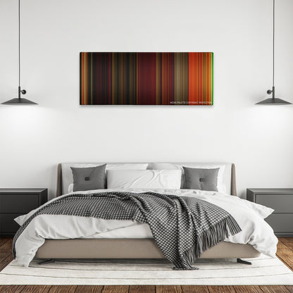 Irreversible color palette canvas above a bed, between two black pendant lamps
