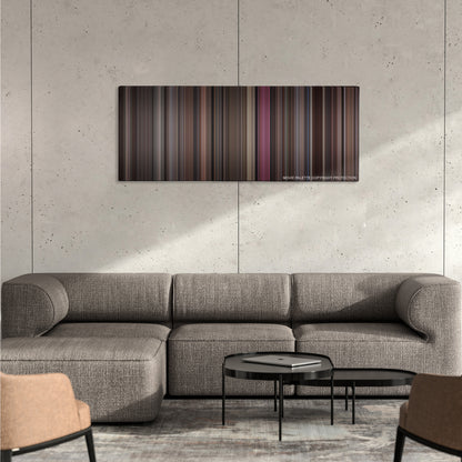 The Boondock Saints color palette canvas on a concrete wall above a gray sectional sofa