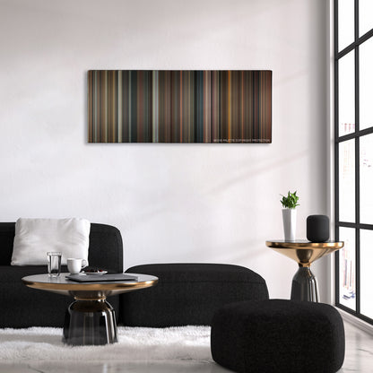 Night at the Museum: Battle of the Smithsonian color palette canvas above a black sofa with a gold-topped table