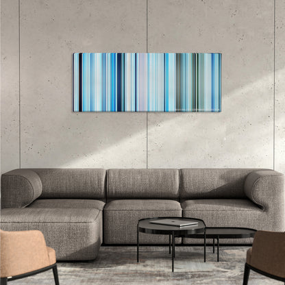 Happy Feet color palette canvas on a concrete wall above a gray sectional sofa