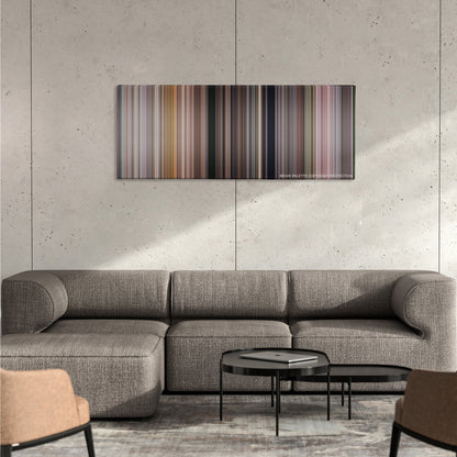 Notting Hill color palette canvas on a concrete wall above a gray sectional sofa