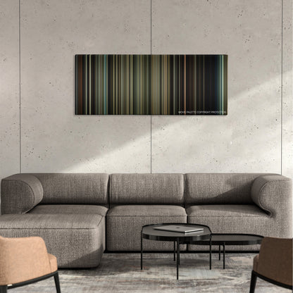 Contraband color palette canvas on a concrete wall above a gray sectional sofa