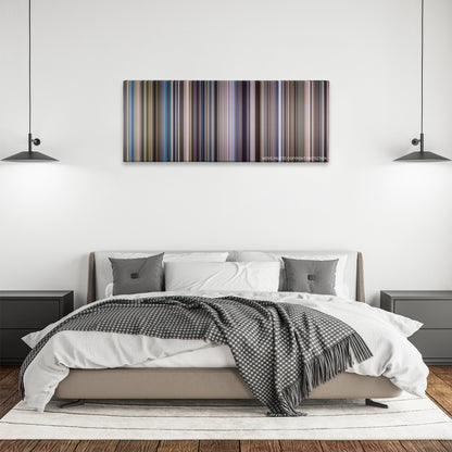 Outbreak color palette canvas above a bed, between two black pendant lamps