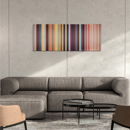 The Waterboy color palette canvas on a concrete wall above a gray sectional sofa