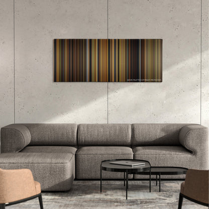 Babe color palette canvas on a concrete wall above a gray sectional sofa