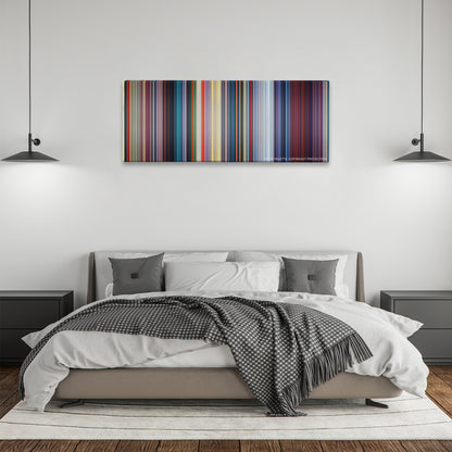 Mulan color palette canvas above a bed, between two black pendant lamps