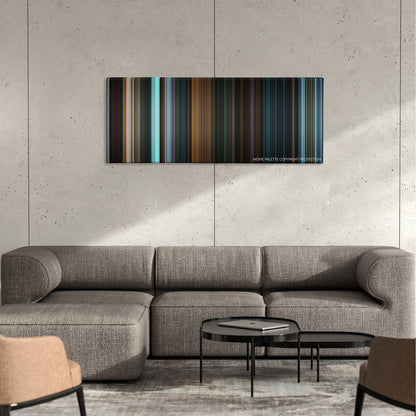 The Predator color palette canvas on a concrete wall above a gray sectional sofa