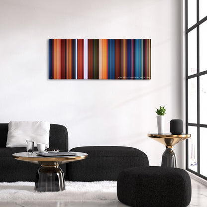 Kubo and the Two Strings color palette canvas above a black sofa with a gold-topped table