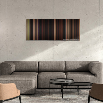 Blue Velvet color palette canvas on a concrete wall above a gray sectional sofa