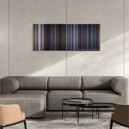 The 6th Day color palette canvas on a concrete wall above a gray sectional sofa