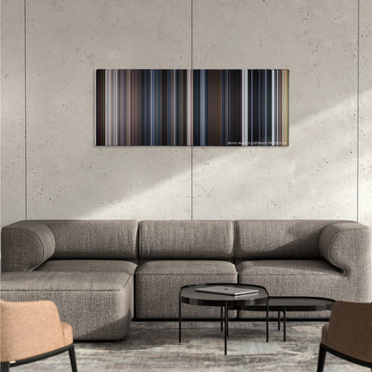 The X Files color palette canvas on a concrete wall above a gray sectional sofa