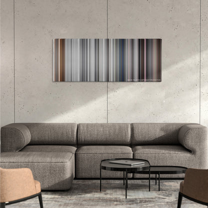 Pleasantville color palette canvas on a concrete wall above a gray sectional sofa