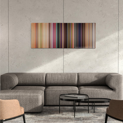 Toy Story color palette canvas on a concrete wall above a gray sectional sofa