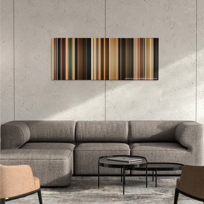 Her color palette canvas on a concrete wall above a gray sectional sofa