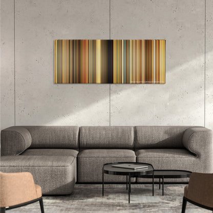 The Darjeeling Limited color palette canvas on a concrete wall above a gray sectional sofa