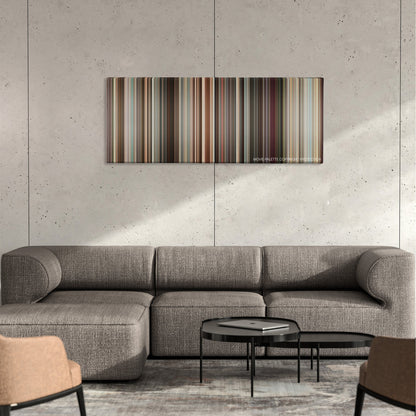 Sex and the City color palette canvas on a concrete wall above a gray sectional sofa