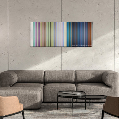 Robin Hood color palette canvas on a concrete wall above a gray sectional sofa