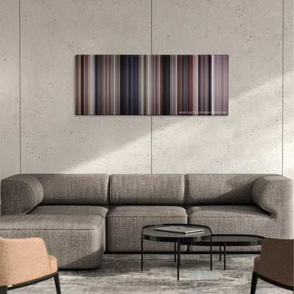 Empire of the Sun color palette canvas on a concrete wall above a gray sectional sofa