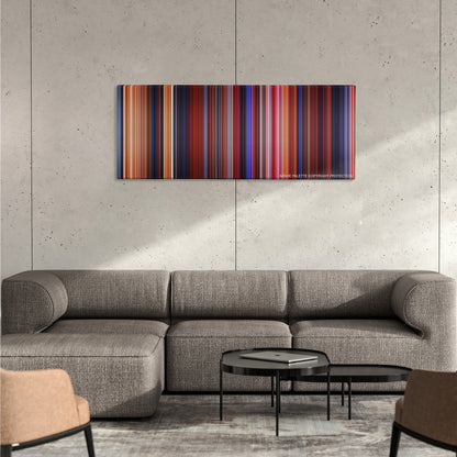 Beauty and the Beast color palette canvas on a concrete wall above a gray sectional sofa