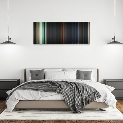 The Nun color palette canvas above a bed, between two black pendant lamps