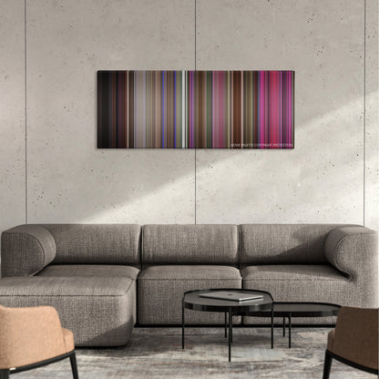 Mallrats color palette canvas on a concrete wall above a gray sectional sofa