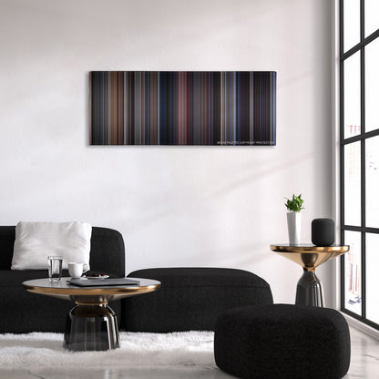 The Fly color palette canvas above a black sofa with a gold-topped table
