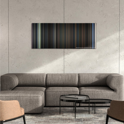 Evil Dead II color palette canvas on a concrete wall above a gray sectional sofa