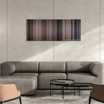 Ghostbusters color palette canvas on a concrete wall above a gray sectional sofa
