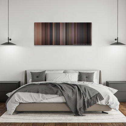 Rear Window color palette canvas above a bed, between two black pendant lamps