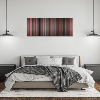 Home Alone color palette canvas above a bed, between two black pendant lamps