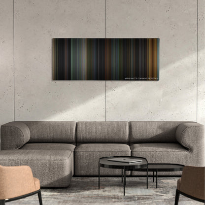 House of Wax color palette canvas on a concrete wall above a gray sectional sofa
