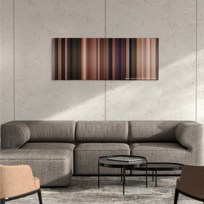 Field of Dreams color palette canvas on a concrete wall above a gray sectional sofa