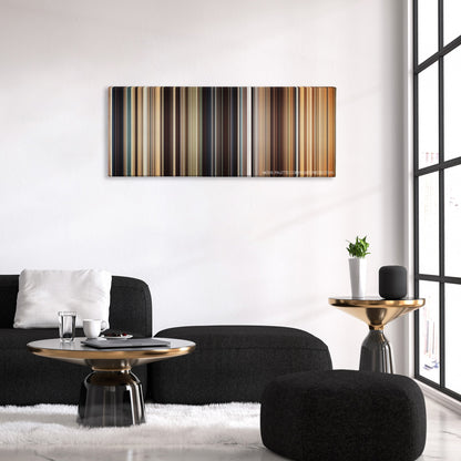 I Origins color palette canvas above a black sofa with a gold-topped table