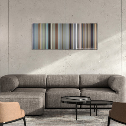 Office Space color palette canvas on a concrete wall above a gray sectional sofa