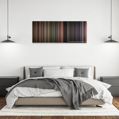 Stalker color palette canvas above a bed, between two black pendant lamps