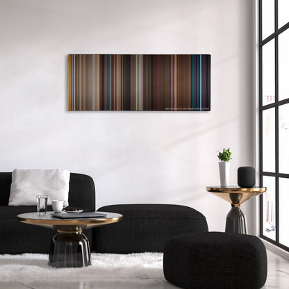 Get Him to the Greek color palette canvas above a black sofa with a gold-topped table