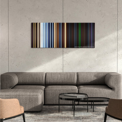 Pitch Black color palette canvas on a concrete wall above a gray sectional sofa